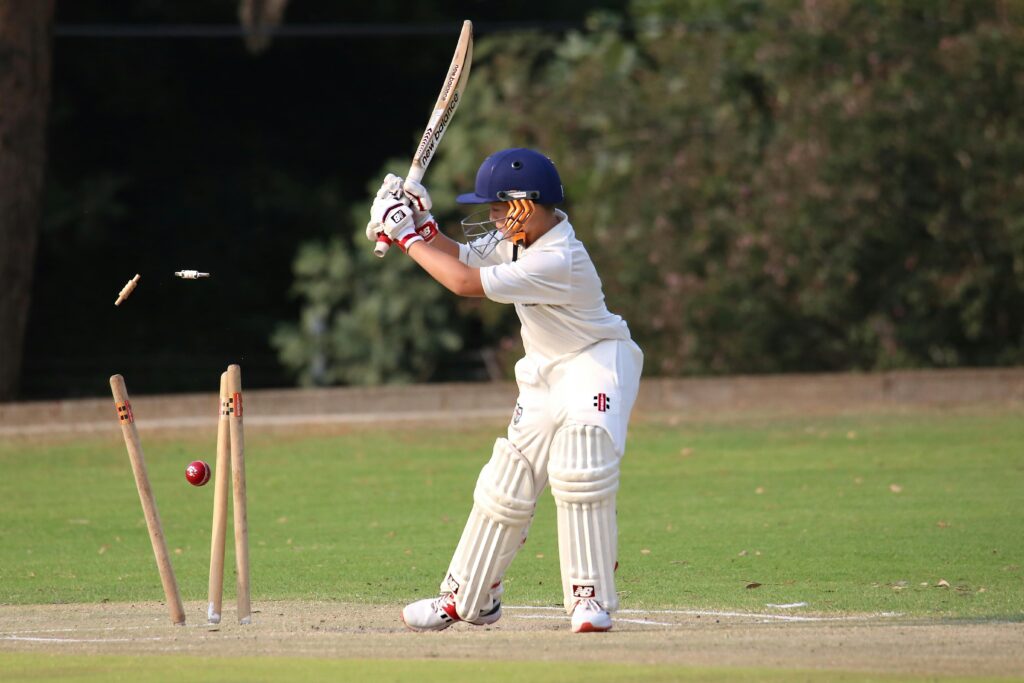 pexels-photo-3689540-3689540 Young cricket player in focused action on the field. Capturing the moment of impact.
